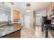 Kitchen with granite counters, tile backsplash, and black appliances at 1975 Westminster Pl, Columbus, IN 47201