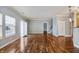 Bright living room with hardwood floors, neutral walls, and sliding doors to the outdoor area at 1975 Westminster Pl, Columbus, IN 47201