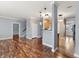 Open concept living room with hardwood floors and stairs to the second floor at 1975 Westminster Pl, Columbus, IN 47201
