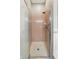 A simple, clean shower stall features pink tiles and a clear glass door at 1975 Westminster Pl, Columbus, IN 47201