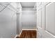 A walk-in closet with wire shelving and hardwood floors offers storage solutions at 1975 Westminster Pl, Columbus, IN 47201