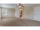 Bedroom showcasing a ceiling fan, carpet, and view of the ensuite bathroom at 2091 Banburry Pl, Avon, IN 46123