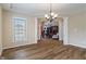 Bright dining area with hardwood floors, and arched entryway to adjacent room at 2091 Banburry Pl, Avon, IN 46123