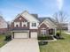 Beautiful two-story brick home with a two-car garage and professionally landscaped front yard at 2091 Banburry Pl, Avon, IN 46123