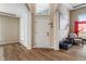 Grand foyer with hardwood floors, decorative columns, and a large front door at 2091 Banburry Pl, Avon, IN 46123
