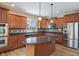 Modern kitchen with stainless steel appliances, custom cabinets, and a center island at 2091 Banburry Pl, Avon, IN 46123