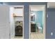 Laundry room with new appliances beside a half bath with modern fixtures and blue accent walls at 2091 Banburry Pl, Avon, IN 46123