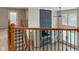 View of the living room from the 2nd floor hallway featuring a fireplace and built-in shelving at 2091 Banburry Pl, Avon, IN 46123