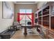 Well-appointed office with custom built-ins, hardwood floors, and bright window at 2091 Banburry Pl, Avon, IN 46123