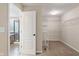 Walk-in closet next to ensuite bathroom featuring ample shelving at 2091 Banburry Pl, Avon, IN 46123