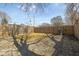 Fenced backyard featuring gravel area, providing privacy and a sense of outdoor space at 2155 S Delaware St, Indianapolis, IN 46225