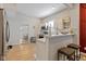 Bright kitchen with white cabinets, breakfast bar, and stainless steel appliances at 2155 S Delaware St, Indianapolis, IN 46225