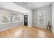Inviting living room with hardwood floors, modern gray walls, and a bright window view at 2155 S Delaware St, Indianapolis, IN 46225