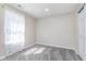 Bright bedroom with neutral walls, plush carpeting, and natural light from a window at 2425 Silver E Ct, Carmel, IN 46033