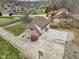 Aerial shot of a home with a large driveway, basketball hoop, and spacious yard, in a residential neighborhood at 2525 Sunderland Dr, Martinsville, IN 46151