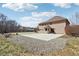 View of the home's backyard featuring a patio, rock garden, and basketball hoop in the distance at 2525 Sunderland Dr, Martinsville, IN 46151