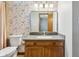 The bathroom features a floral wallpaper, granite vanity, and ceramic toilet at 2525 Sunderland Dr, Martinsville, IN 46151
