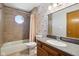 The bathroom features floral wallpaper, granite vanity, and ceramic tiling in the shower at 2525 Sunderland Dr, Martinsville, IN 46151