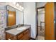 This bathroom features a granite vanity and a floral wallpaper at 2525 Sunderland Dr, Martinsville, IN 46151