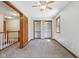 Bedroom features a window, a ceiling fan, and a closet with shelving at 2525 Sunderland Dr, Martinsville, IN 46151