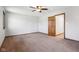 Spacious bedroom with neutral walls, ceiling fan, and natural light from windows at 2525 Sunderland Dr, Martinsville, IN 46151