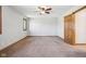 Spacious bedroom with neutral walls, ceiling fan, and natural light from windows at 2525 Sunderland Dr, Martinsville, IN 46151