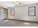 Bedroom featuring two windows, a ceiling fan, and carpet flooring at 2525 Sunderland Dr, Martinsville, IN 46151