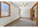 Bedroom featuring two windows, ceiling fan, and carpet flooring at 2525 Sunderland Dr, Martinsville, IN 46151