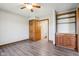 Bedroom with hardwood floors, built in shelving, and ensuite bathroom at 2525 Sunderland Dr, Martinsville, IN 46151
