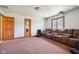 Spacious carpeted bonus room with large seating area and projector at 2525 Sunderland Dr, Martinsville, IN 46151