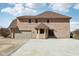 Two-story home featuring a wooden facade with attached garage, sunroom, and paved driveway at 2525 Sunderland Dr, Martinsville, IN 46151
