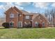 Charming two-story brick home with a well-manicured lawn and a classic, inviting facade at 2525 Sunderland Dr, Martinsville, IN 46151