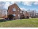 Charming two-story brick home with a well-manicured lawn and a classic, inviting facade at 2525 Sunderland Dr, Martinsville, IN 46151
