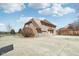 Charming two-story home featuring a brick and wooden facade with attached garage and paved driveway at 2525 Sunderland Dr, Martinsville, IN 46151