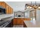 Kitchen with wood cabinetry, granite countertops, stainless appliances, and an island at 2525 Sunderland Dr, Martinsville, IN 46151