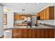 Eat-in kitchen featuring stainless steel appliances, wood cabinets and island at 2525 Sunderland Dr, Martinsville, IN 46151