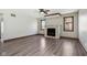 Living room featuring a stone fireplace, two windows and modern flooring at 2525 Sunderland Dr, Martinsville, IN 46151