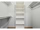 Well-organized walk-in closet with adjustable shelving and closet rods at 2525 Sunderland Dr, Martinsville, IN 46151