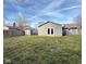View of a spacious, grassy backyard with a storage shed and a privacy fence at 2638 Calbert Dr, Indianapolis, IN 46219