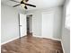 Bedroom features fresh paint, new flooring, a closet, and ceiling fan with light fixture at 2638 Calbert Dr, Indianapolis, IN 46219