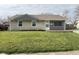 Charming single-story home featuring a well-maintained lawn and a stone and vinyl exterior at 2638 Calbert Dr, Indianapolis, IN 46219