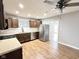Updated kitchen with stainless steel appliances, dark wood cabinets, stone countertops and modern backsplash at 2638 Calbert Dr, Indianapolis, IN 46219