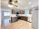 Kitchen features stainless appliances, dark wood cabinets, stone countertops, and a stainless steel sink at 2638 Calbert Dr, Indianapolis, IN 46219