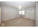 Spacious bedroom with plush carpet, ceiling fan, and a double door closet at 3013 Crimson W Ct # 42, Carmel, IN 46033