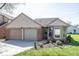 Charming home with a two-car garage, tidy landscaping, and great curb appeal at 3013 Crimson W Ct # 42, Carmel, IN 46033