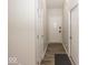 Hallway features modern wood floors and neutral paint at 3013 Crimson W Ct # 42, Carmel, IN 46033
