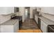 Galley kitchen with stainless steel appliances and granite countertops at 3013 Crimson W Ct # 42, Carmel, IN 46033