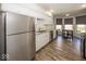 Modern kitchen with white cabinetry, stainless steel appliances, and wood floors at 3013 Crimson W Ct # 42, Carmel, IN 46033