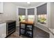 Bright breakfast nook with new countertops and kitchen island overlooking the beautiful lawn at 3013 Crimson W Ct # 42, Carmel, IN 46033