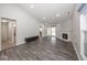 Bright living room with sleek wood floors, fireplace and sliding glass doors at 3013 Crimson W Ct # 42, Carmel, IN 46033
